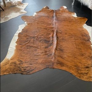 Brown and white w brindle cowhide rug